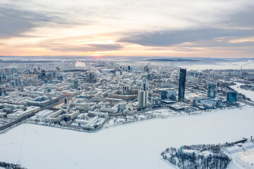 Yekaterinburg aerial panoramic view in Winter at sunset. Yekaterinburg city and pond in winter.
