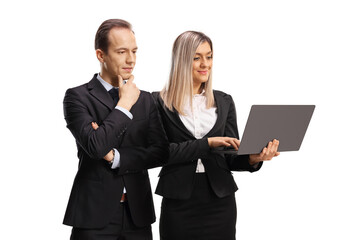 Businesswoman holding on a laptop computer and a businessman looking and thinking