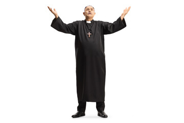 Full length portrait of a priest raising arms towards sky