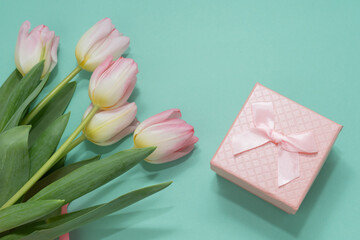 Pink gift box  and bouquet of pink tulips.