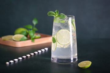 mojito cocktail with mint and lemon is on the table