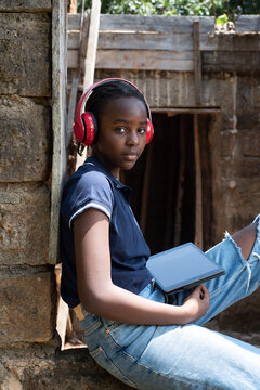 Portrait of a teenage African Girl with headphones
