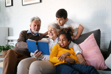 Multiethnic mixed race family education at home. Grandparents with children