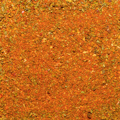 Photo of closeup texture of orange spice for meat and chicken and other food, background