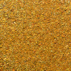 Photo of closeup texture of orange spice for meat and chicken, background