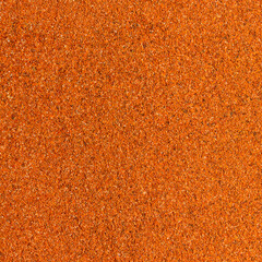 Photo of closeup texture of hot spice of red pepper for different food, background
