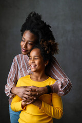 Family portrait. Loving mother and daughter at home hugging. Love, people, happiness concept.