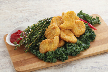 Crispy chicken nuggets with tomato ketchup