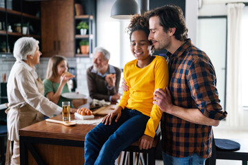 Happy multiethnic single father having fun with black child girl. Family, people, happiness concept.