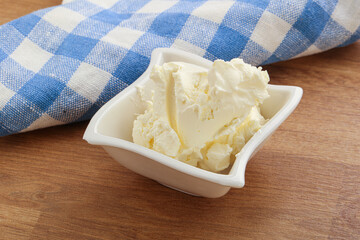 Italian soft mascarpone cheese in the bowl