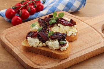 Bruschetta with soft cheese and tomato