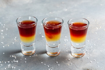 Three layered shots. Set of cocktails at the bar. alcoholic cocktail drinks shot