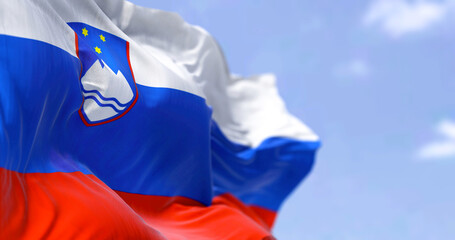 Detail of the national flag of Slovenia waving in the wind on a clear day