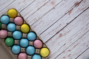 Easter eggs in egg carton for easter hunt. Copy Space. 