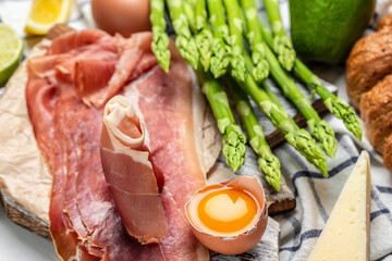 Asparagus. bunch of fresh asparagus, jamon, ham, prosciutto Pickled Green Asparagus. Close up. Keto Paleo diet menu, top view