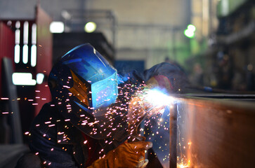 A welder works at a factory	
