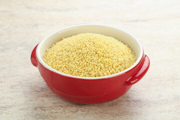 Raw couscous in the bowl