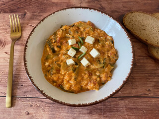 Creamy zucchini stew with feta cheese. Vegetarian, dish.