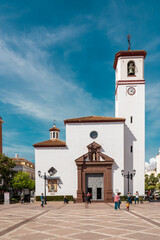 Constitution Square in the center of Fuengirola city with view of the Church "Nuestra Señora del Rosario". Famous plaza in old town center of the city.