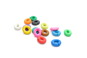 rings of multicolored plasticine on a white background