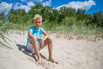 Teenager boy on summer vocation at the beach