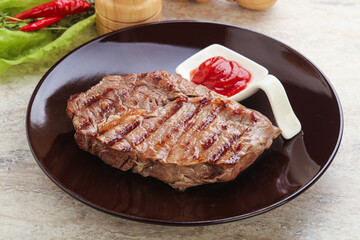 Grilled rib-eye steak beef meat