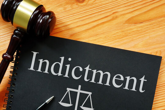 Indictment is shown on the photo using the text