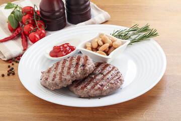 Grilled beef burger cutlet with sauce