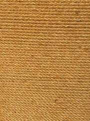 rope twine straw entwined yellow background