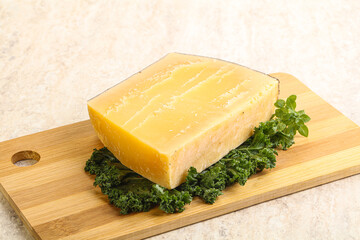 Parmesan cheese piece over board