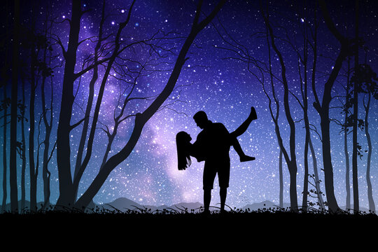 Lovers at night. Couple silhouette in forest. Milky Way at starry sky