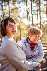 Two middle-aged women   in spring park