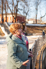 Сasual senior women looking away at embankment