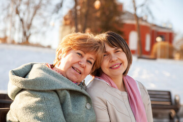 Fototapeta premium Middle-aged women on walk in spring park
