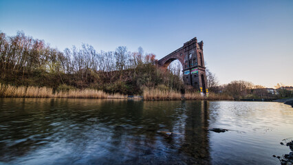 Dortmund, GERMANY - 19. March 2022: old viaduct at sunrise near the industrial area Phoenix West in...