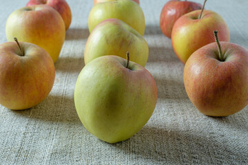 A pile of apples on a rough cloth
