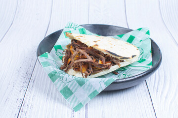 Mix of Colombian corn arepas, traditional flavors with meat, vegetables and cheese