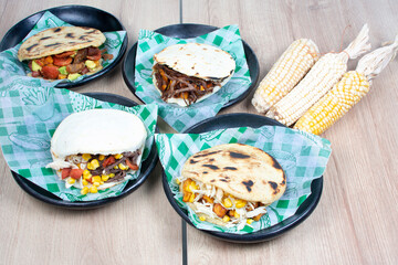 Mix of Colombian corn arepas, traditional flavors with meat, vegetables and cheese