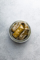 Dolmades. Stuffed vine leaves. Greek appetizer in jar.