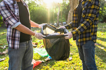 Collecting the garbage and separating waste to freshen the problem of environmental pollution and...