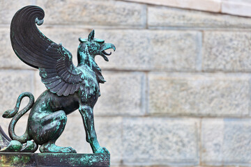Metal griffin statue