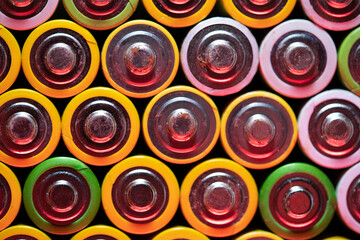 Closeup top view of used battery. lot of AA batteries. Electronic hazardous waste, recycling...