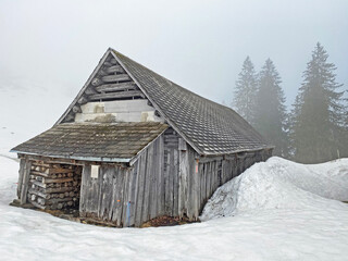 Mountain huts (chalets) or farmhouses and old wooden cattle houses in the valley of Wägital or Waegital and by the alpine Lake Wägitalersee (Waegitalersee or Wagitalersee), Innerthal - Switzerland