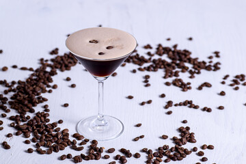 Espresso Martini cocktail with coffee beans in background