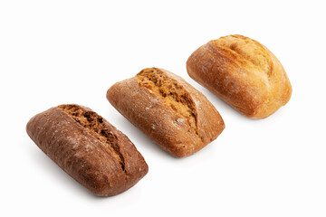 Freshly baked buns of different sorts wheat and rye isolated on a white background with shadow