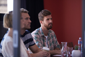 An informal business meeting. A group of informal businesspeople in a meeting.