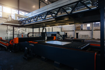 Naklejka premium Working CNC laser cutting machine