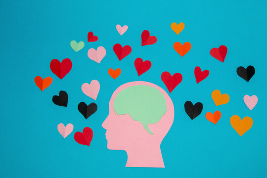 pink paper head and blue brain in it, around many colorful hearts, man in love and love of the air, head as copy space, flat design, human composition in love