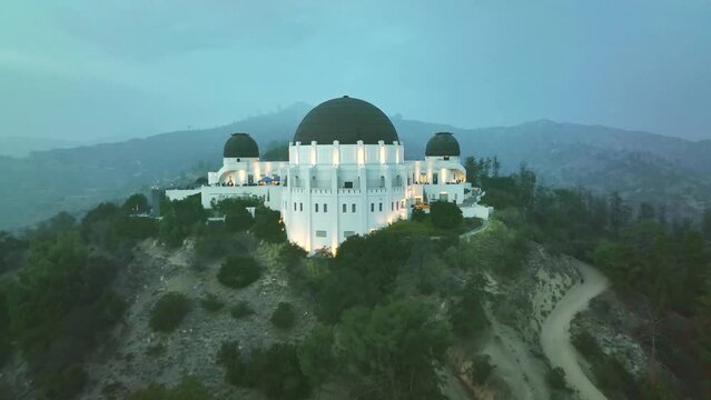Aerial drone shot. Night Los Angeles. flying over Griffith Observatory. Los Angeles landscape. California landmark, travel destination in America.