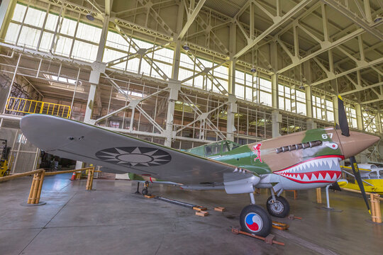 Hawaii, United States - August 2016: Curtiss P-40E Warhawk single-engined Pursuit fighter and ground-attack aircraft of 1938 of Royal Canadian Air Force. Hangar 37 of the Pearl Harbor Aviation Museum.